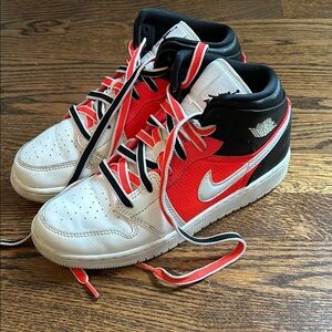 Boys size 5.5 red white and black Jordans